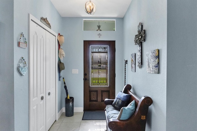 entryway with light tile patterned floors