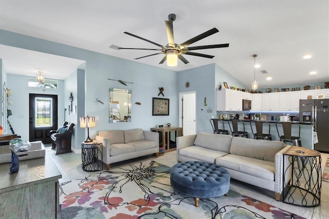 tiled living room featuring vaulted ceiling and ceiling fan