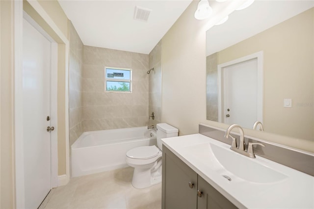 full bathroom featuring vanity, tile patterned floors, toilet, and tiled shower / bath