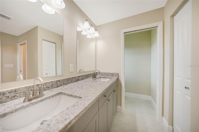 bathroom featuring vanity and tile patterned flooring