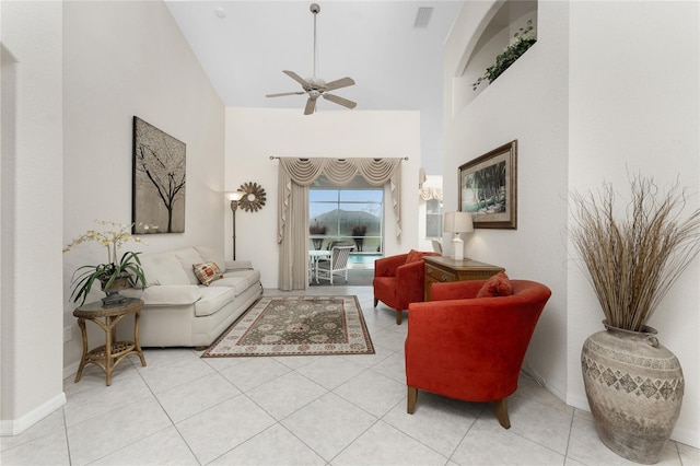 living room with ceiling fan, high vaulted ceiling, and light tile patterned floors