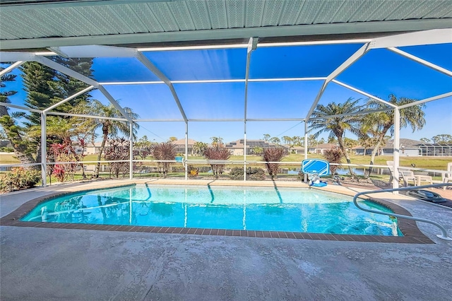 view of pool with a patio and glass enclosure