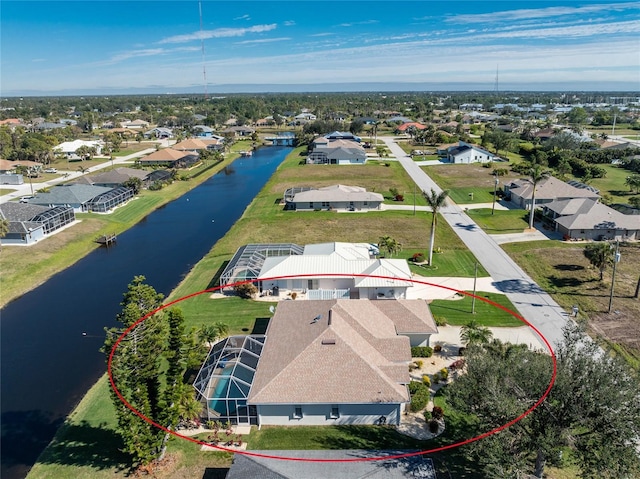 bird's eye view with a water view