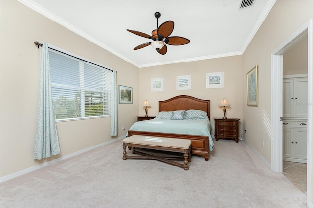 bedroom featuring crown molding, light carpet, and ceiling fan