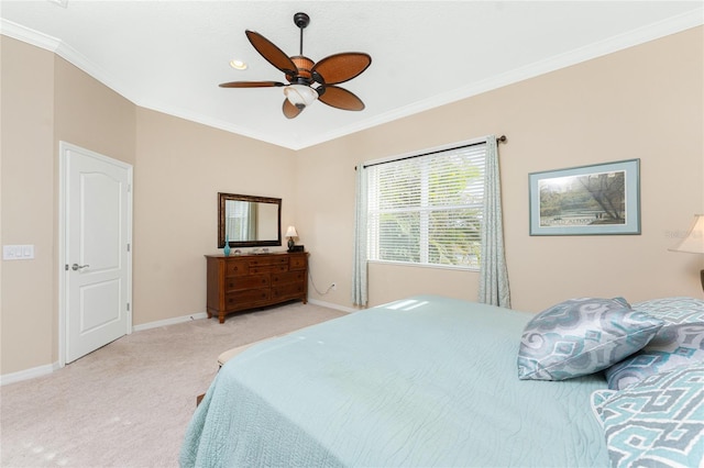 bedroom featuring crown molding, ceiling fan, and light carpet