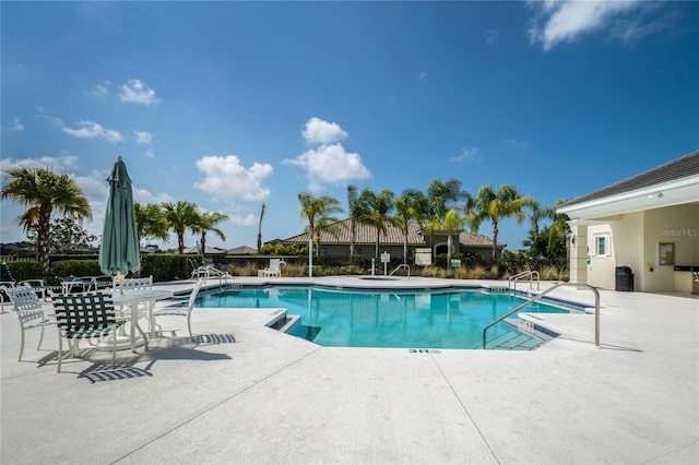 view of swimming pool with a patio