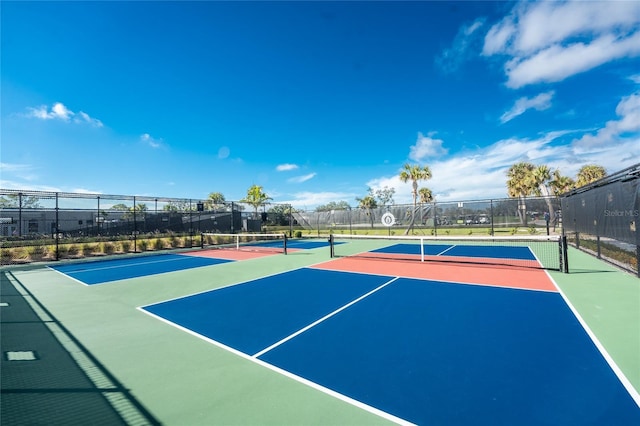 view of sport court with basketball hoop