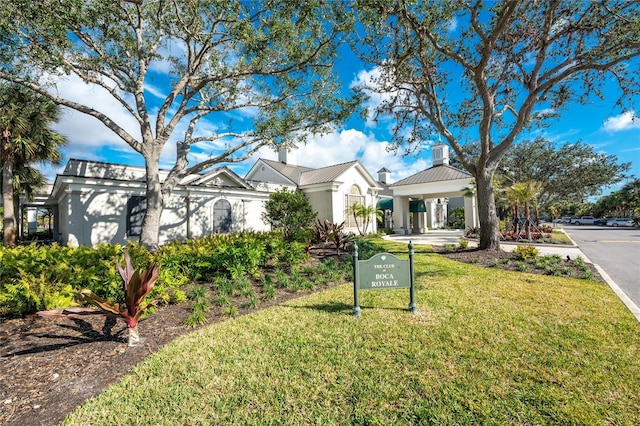 view of front facade featuring a gazebo and a front lawn