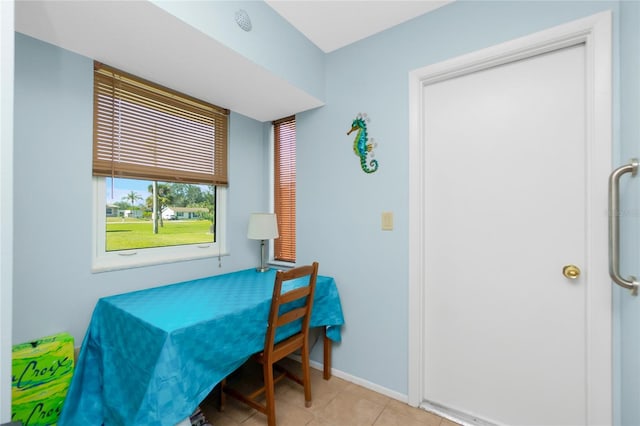 dining area with light tile patterned floors