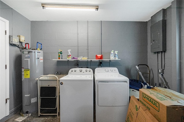 washroom with water heater, washer and dryer, and electric panel