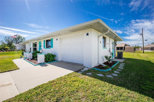 view of home's exterior featuring a garage, a lawn, and central air condition unit