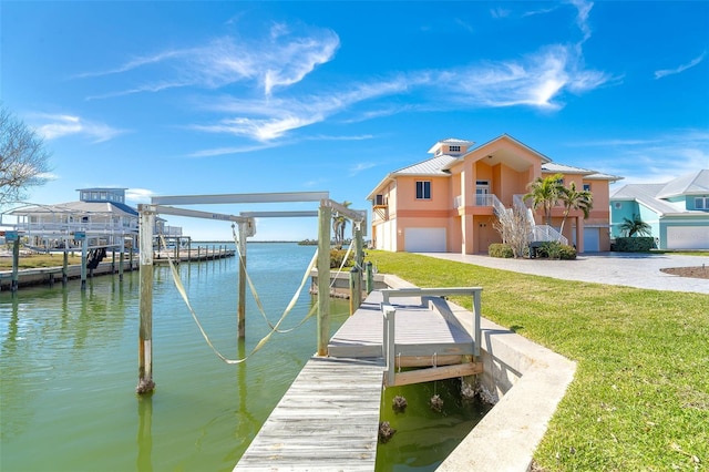 dock area with a water view and a yard