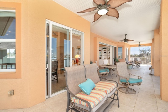 view of patio featuring ceiling fan