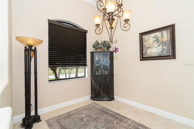 foyer with an inviting chandelier