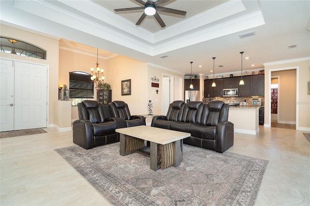 living room featuring a raised ceiling, crown molding, ceiling fan with notable chandelier, and light tile patterned floors