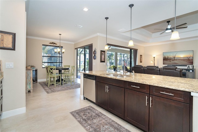 kitchen with light stone counters, decorative light fixtures, dark brown cabinets, and stainless steel dishwasher