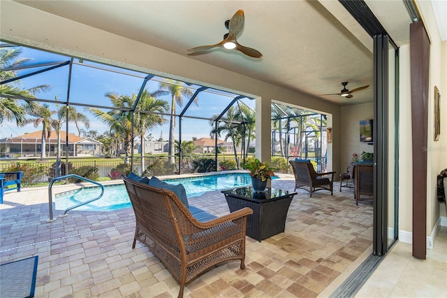 exterior space with a lanai and ceiling fan