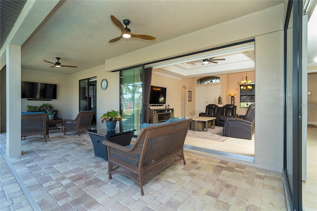 view of patio / terrace with ceiling fan and an outdoor hangout area