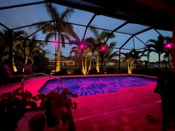 214 W Pine Valley Ln, Rotonda West, FL 33947 - pool featuring glass enclosure