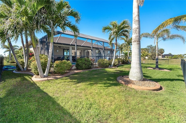 214 W Pine Valley Ln, Rotonda West, FL 33947 - view of yard featuring a lanai and fence