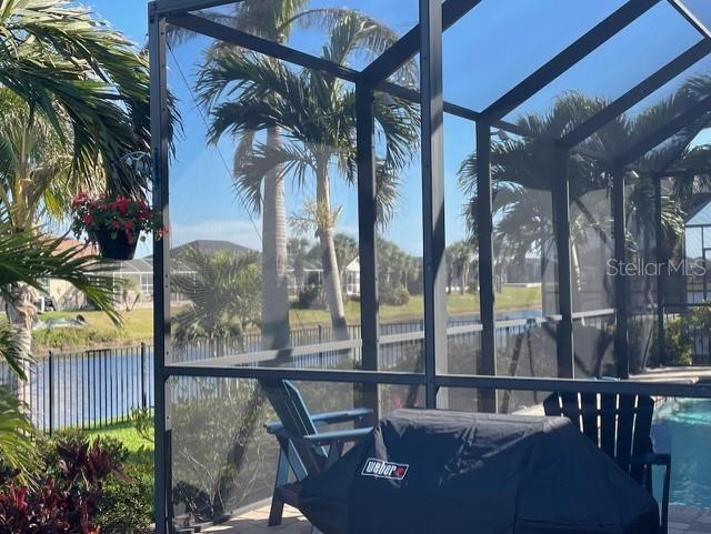 214 W Pine Valley Ln, Rotonda West, FL 33947 - sunroom featuring a water view