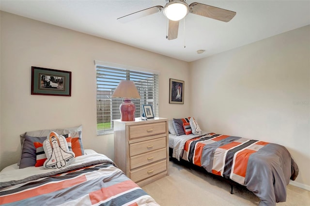 bedroom featuring light carpet and ceiling fan