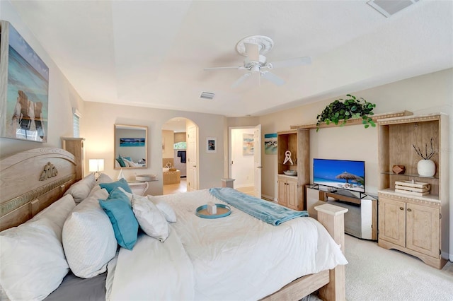 bedroom with ceiling fan and light colored carpet