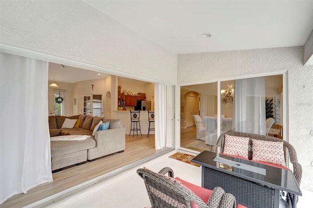 living room featuring vaulted ceiling