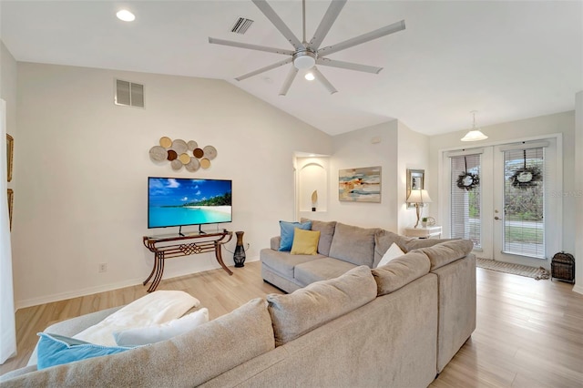 living room featuring french doors, ceiling fan, lofted ceiling, and light hardwood / wood-style floors