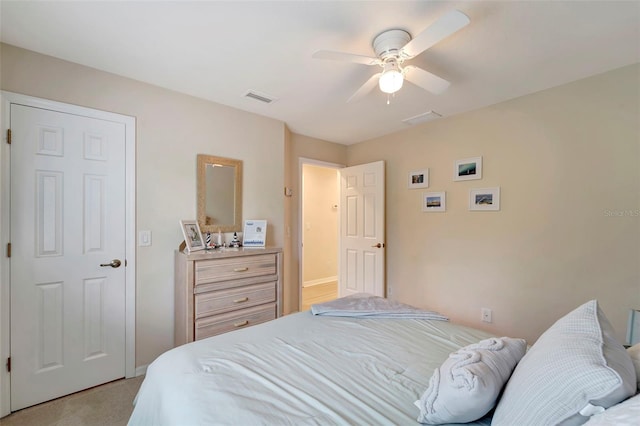 bedroom with ceiling fan and light carpet