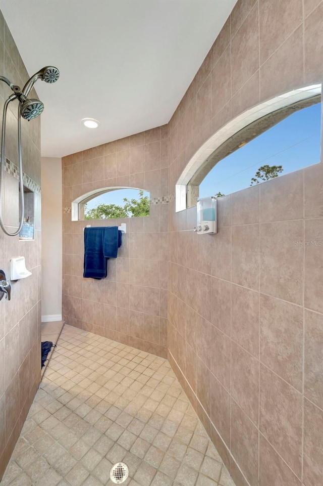 bathroom with tiled shower