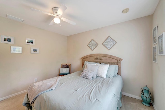 bedroom featuring light colored carpet and ceiling fan