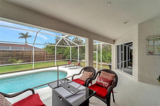 view of pool featuring a lanai and a patio area