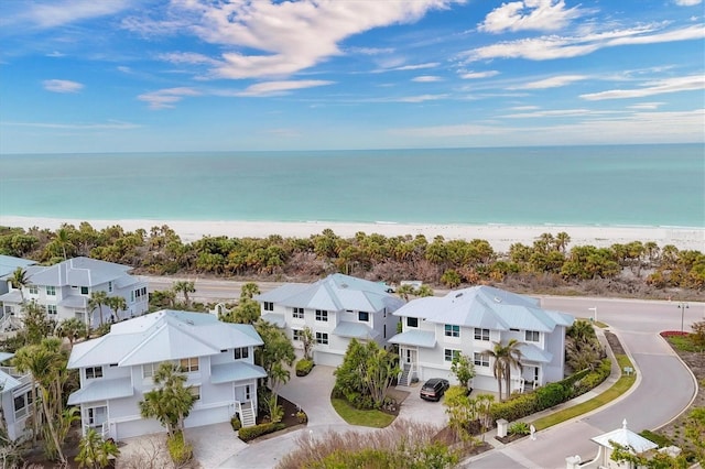 aerial view featuring a water view and a view of the beach