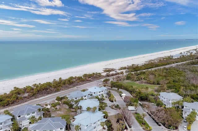 aerial view with a water view and a view of the beach