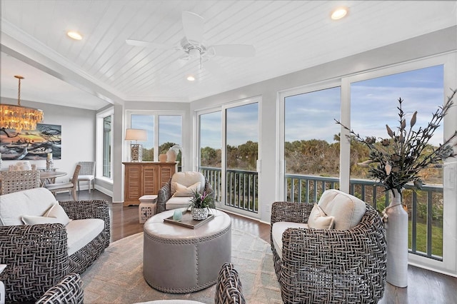 sunroom / solarium featuring ceiling fan and wooden ceiling