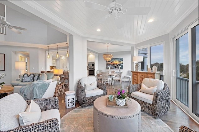 living room with hardwood / wood-style flooring, ceiling fan with notable chandelier, ornamental molding, and wooden ceiling