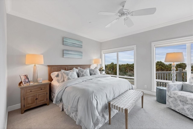 carpeted bedroom with ceiling fan and ornamental molding