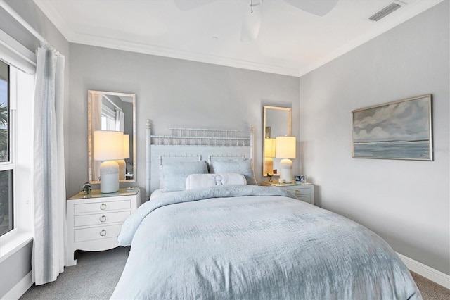 carpeted bedroom featuring ceiling fan, ornamental molding, and multiple windows