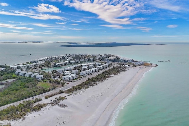 bird's eye view featuring a water view and a view of the beach