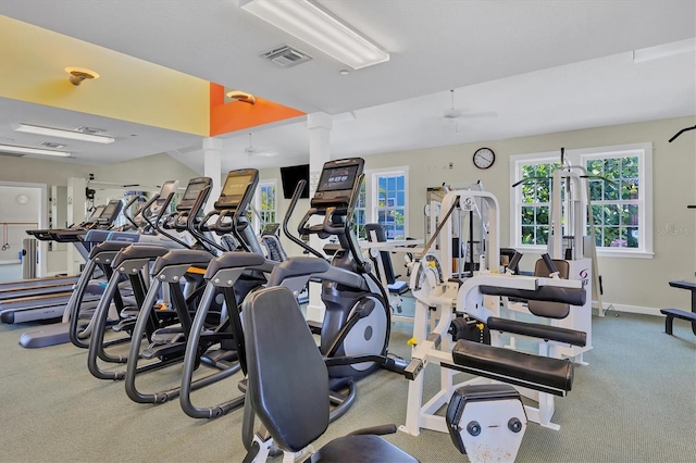 exercise room featuring ceiling fan and decorative columns