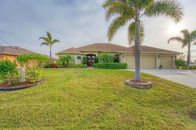 view of front of house featuring a garage and a front yard