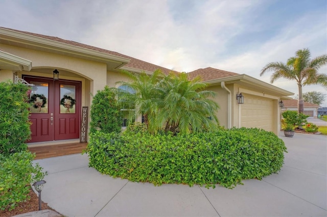 view of exterior entry featuring a garage