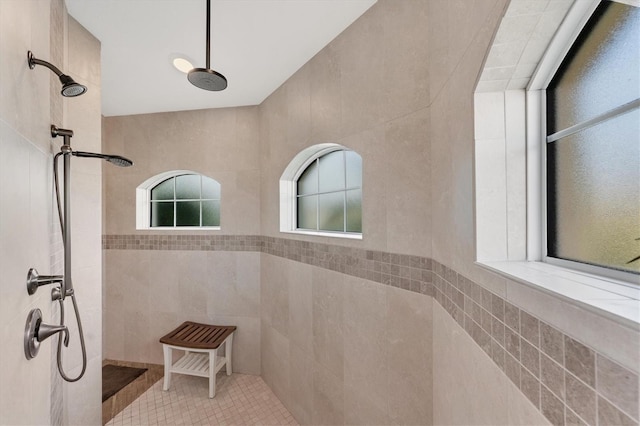 bathroom featuring a tile shower