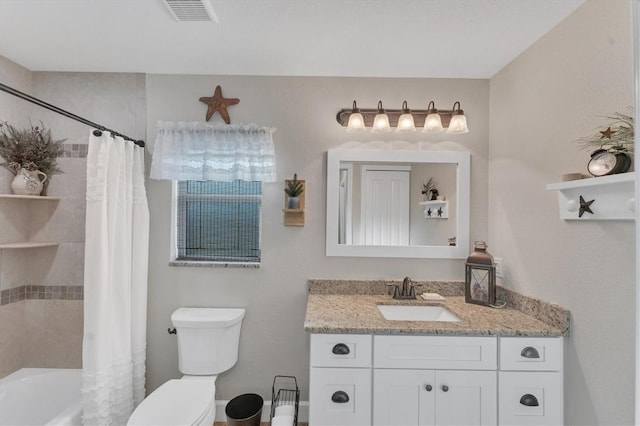 full bathroom with vanity, shower / bath combo, and toilet