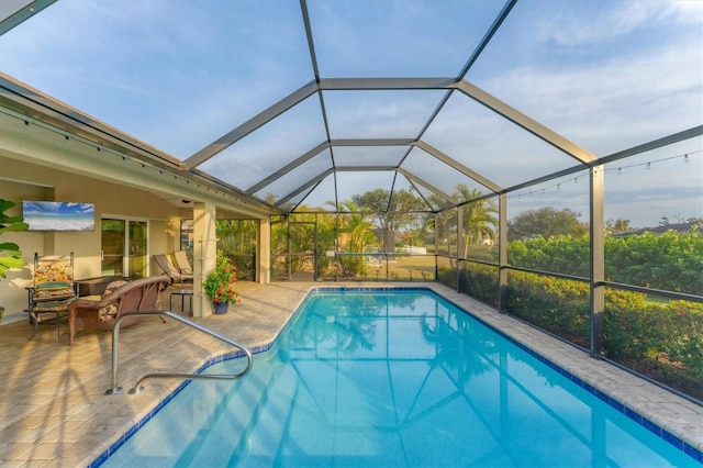 view of pool featuring a lanai and a patio area