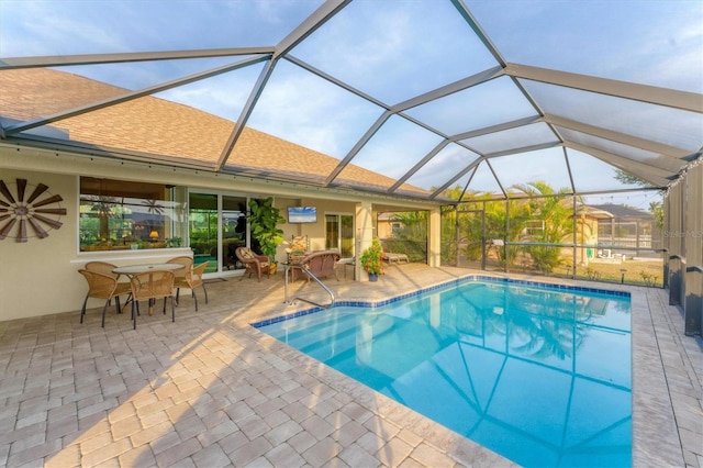 view of pool with a lanai and a patio area