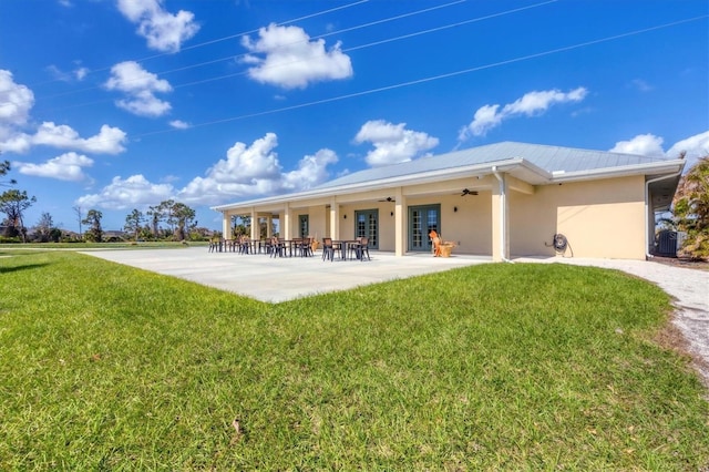 back of house with central AC unit, a lawn, ceiling fan, and a patio area