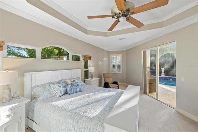 bedroom featuring baseboards, ornamental molding, access to exterior, light carpet, and a raised ceiling