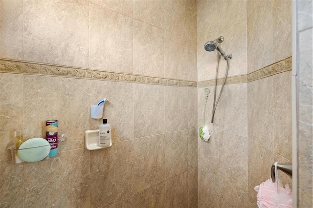 bathroom with a tile shower